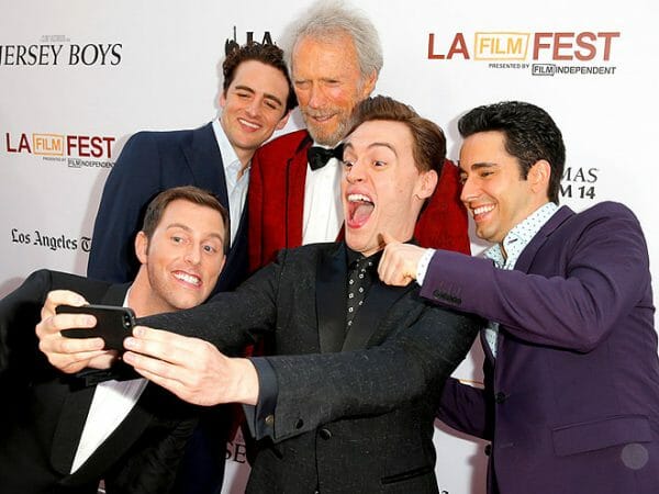 Erich Bergen with director Clint Eastwood and the cast of Jersey Boys.